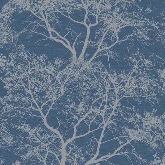 Holden Decor Whispering Trees Wallpaper in Blue Sparkle featuring a blue background with white tree silhouettes.